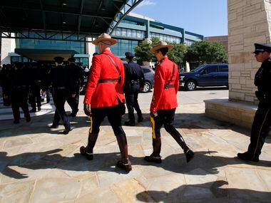 A pair of Royal Canadian Mounted Police arrive at Prestonwood Baptist Church in Plano for...