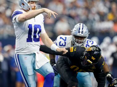 Dallas Cowboys quarterback Cooper Rush (10) throws the ball during the third quarter of the...