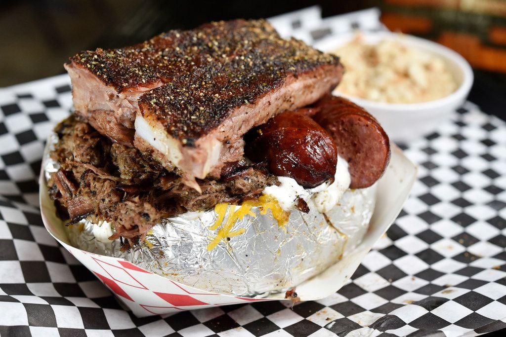 The MVP three-meat baked potato with brisket, sausage and ribs, served with a side of banana...