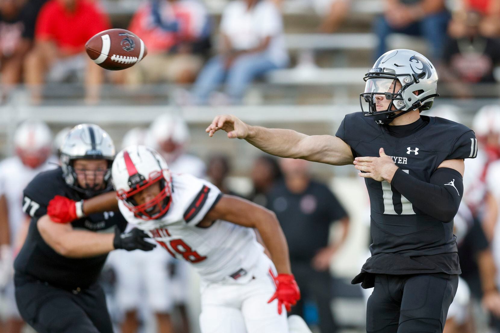 Denton Guyer quarterback Jackson Arnold (11) throws a pass during the first quarter of a...