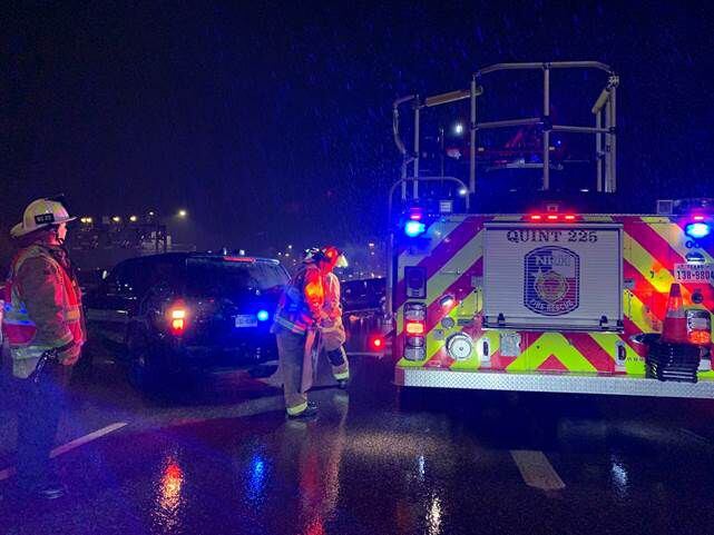 Authorities work the scene of an accident on Loop 820 early Thanksgiving Day morning, Nov....