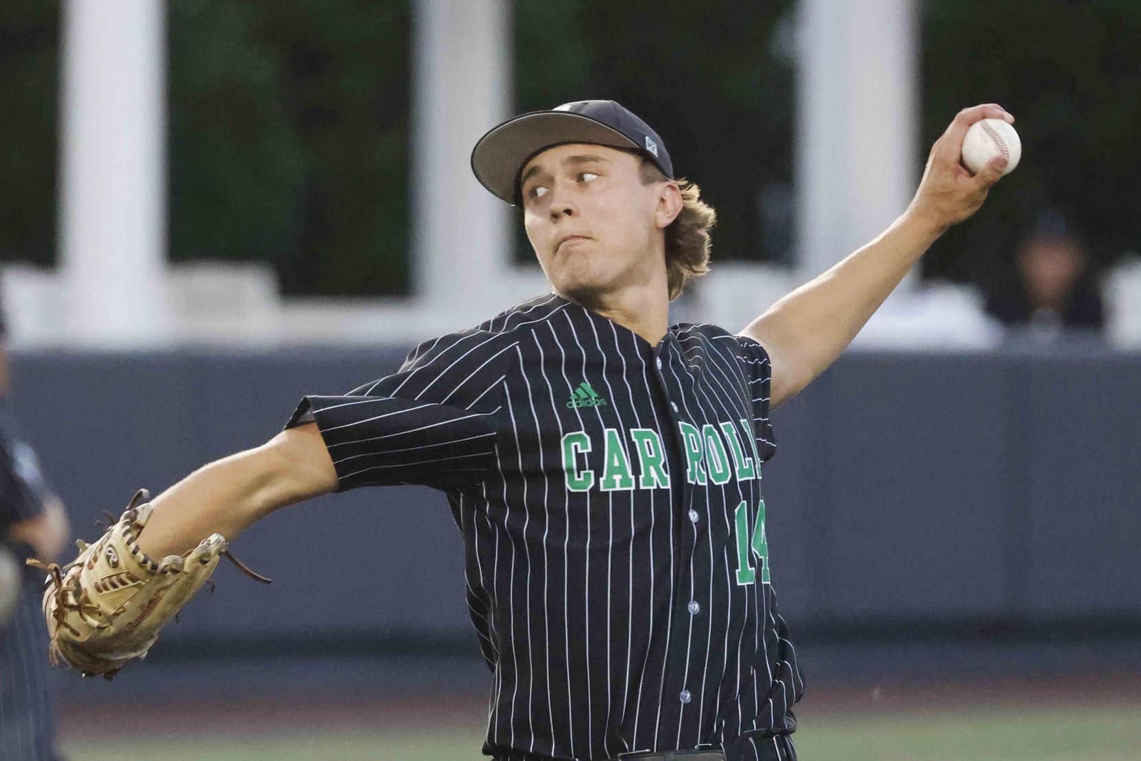 Southlake Carroll’s Griffin Herring pitches during the first inning of a class 6A Region I...