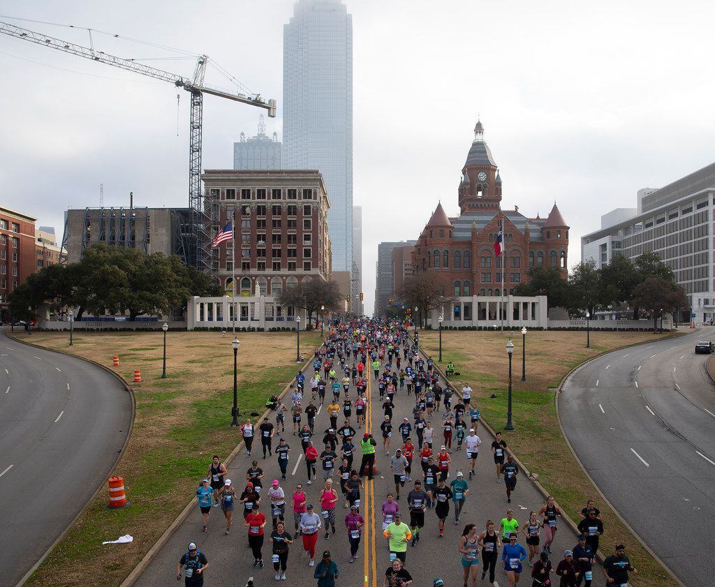 BMW Dallas Marathon runners race down Commerce Street on Dec. 15, 2019 in Dallas. (Juan...