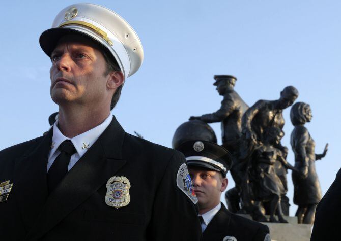 Grapevine Fire Department Honor Guard member Richie Tice stands at attention during a past...