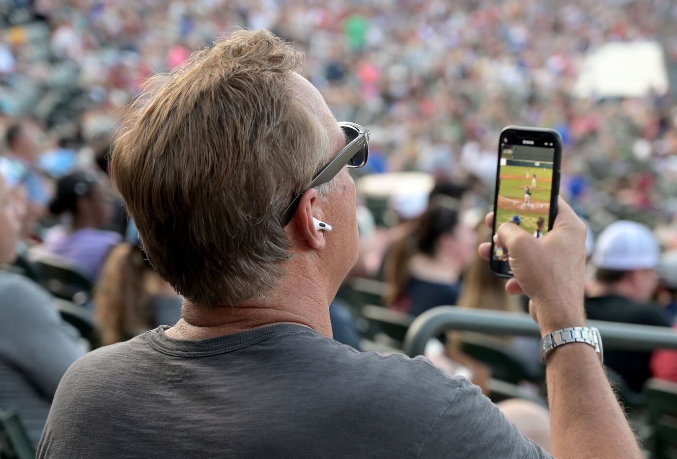 Al Leiter watches as his son Frisco RoughRiders pitcher Jack Leiter (22) pitches during a...