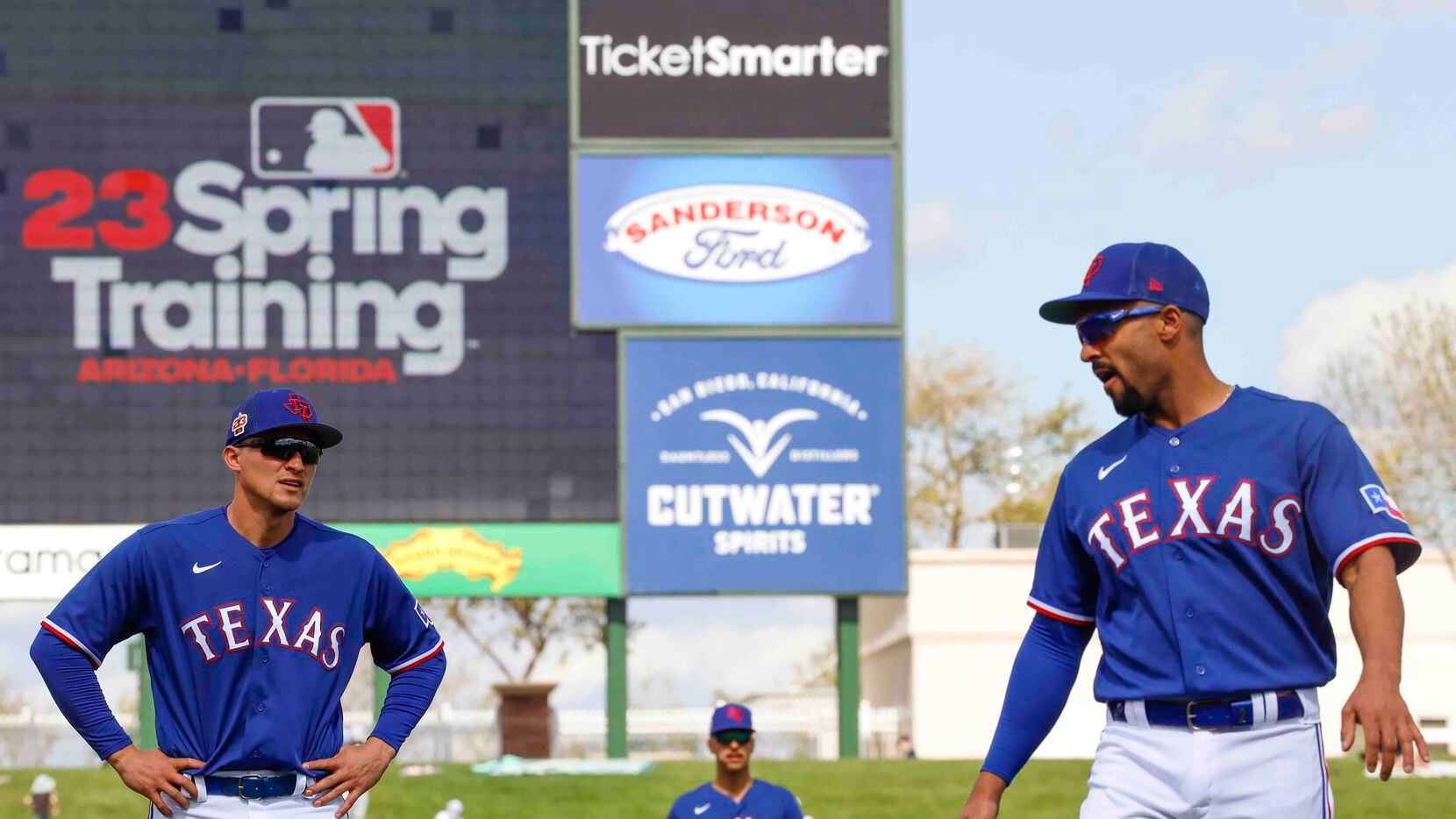 Texas Rangers shortstop Corey Seager (left), first baseman Nathaniel Lowe (center) and...
