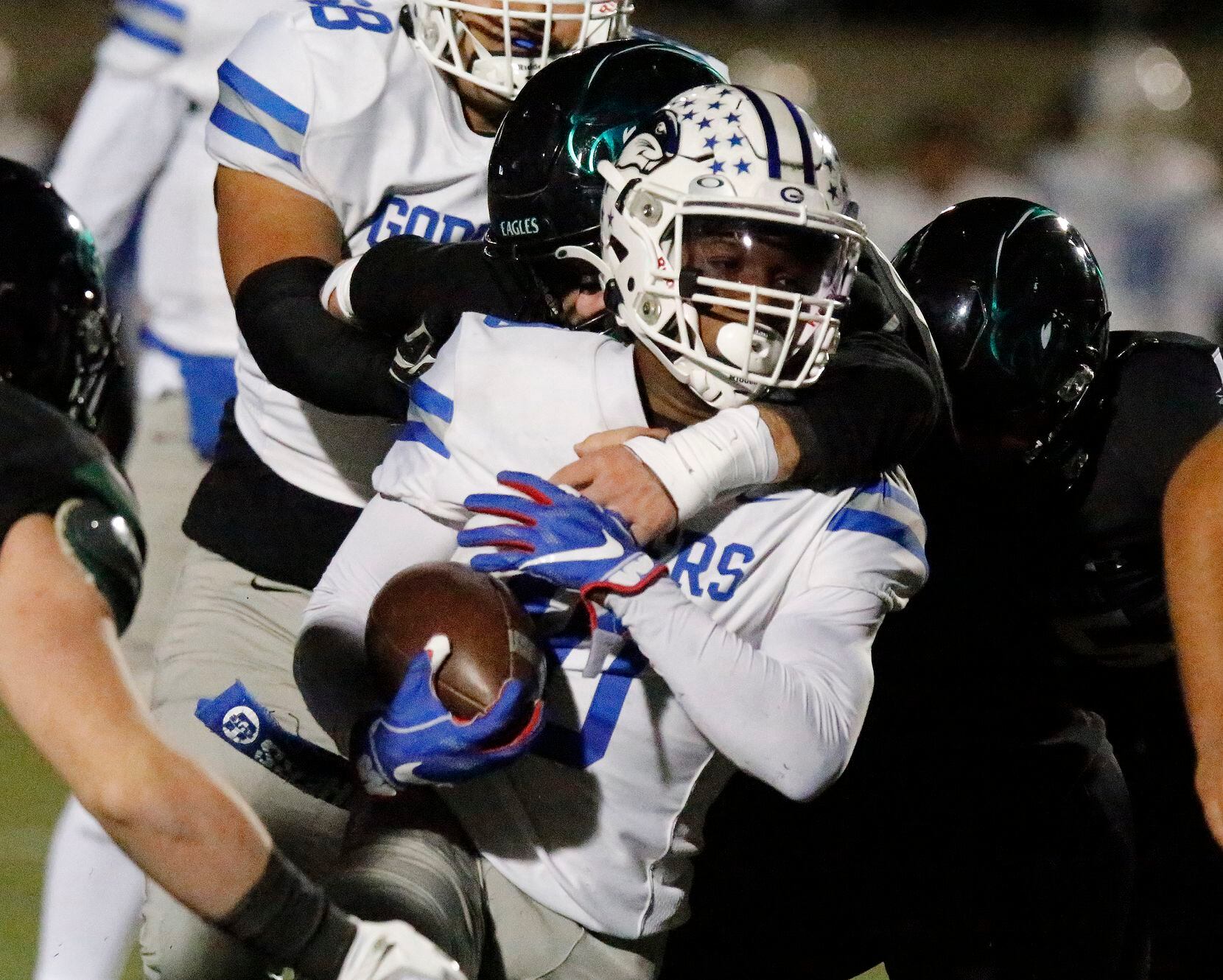 Grand Prairie High School running back Drew Damper (10) is stopped at the line of scrimmage...