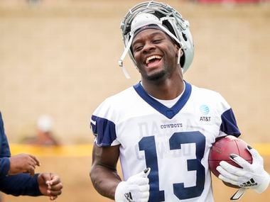 Dallas Cowboys wide receiver Michael Gallup smiles on the sidelines during a practice at training camp on Sunday, July 25, 2021, in Oxnard, Calif. 