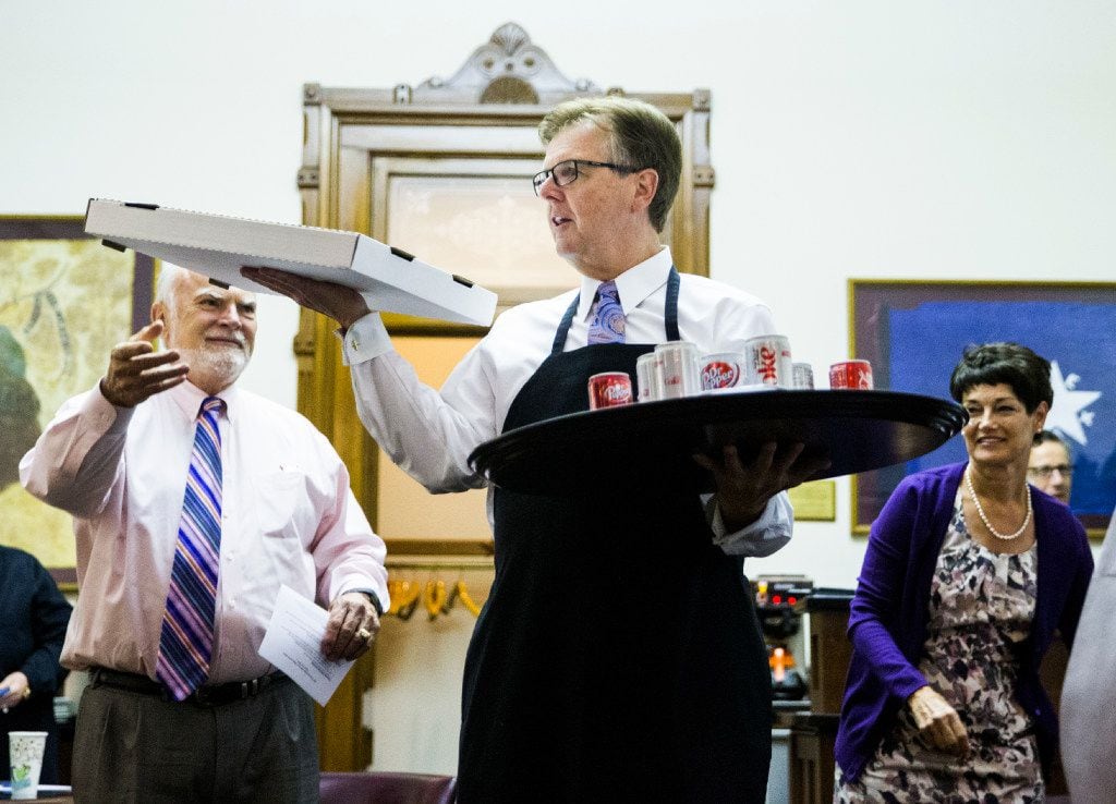 Lt. Gov. Dan Patrick served pizza and soda inside the Senators' Room just before the Senate reconvened at 12:01 a.m. for a third reading of the sunset bill Thursday during the third day of a special legislative session at the Texas Capitol in Austin. 