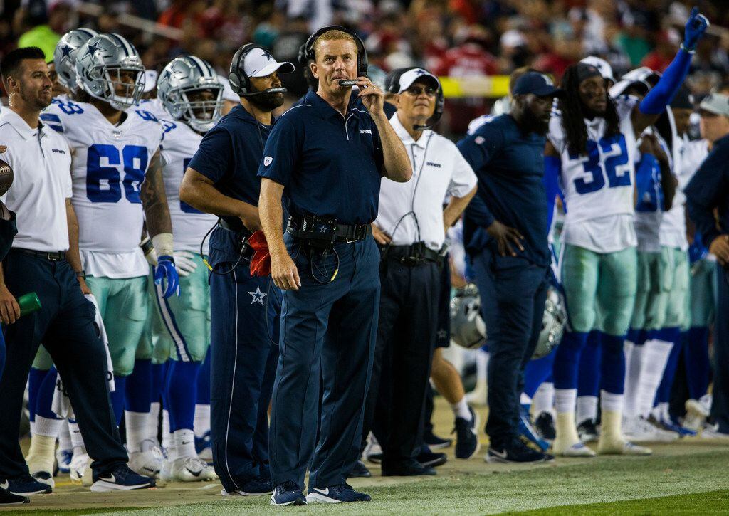 Dallas Cowboys head coach Jason Garrett watches from the sideline during the fourth quarter...