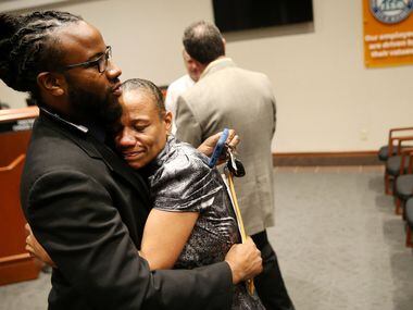 McKinney city councilman La'Shadion Shemwell hugs his mother, Rolanda Mocharia, following a...
