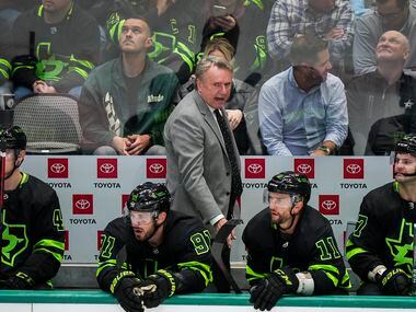 Dallas Stars coach Rick Bowness looks on from the bench during the third period of an NHL hockey game against the Columbus Blue Jackets at the American Airlines Center on Thursday, Dec. 2, 2021, in Dallas. 
