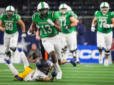 Southlake Carroll wide receiver RJ Maryland (13) is tripped up by Highland Park defensive...