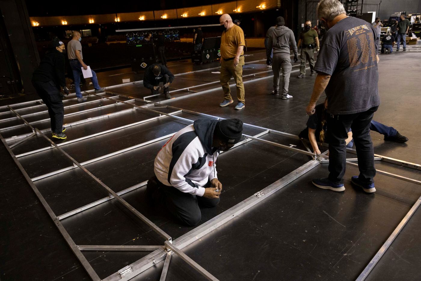 Crews prepare set pieces on stage made by Dallas Stage Scenery for Dallas Opera’s Das...