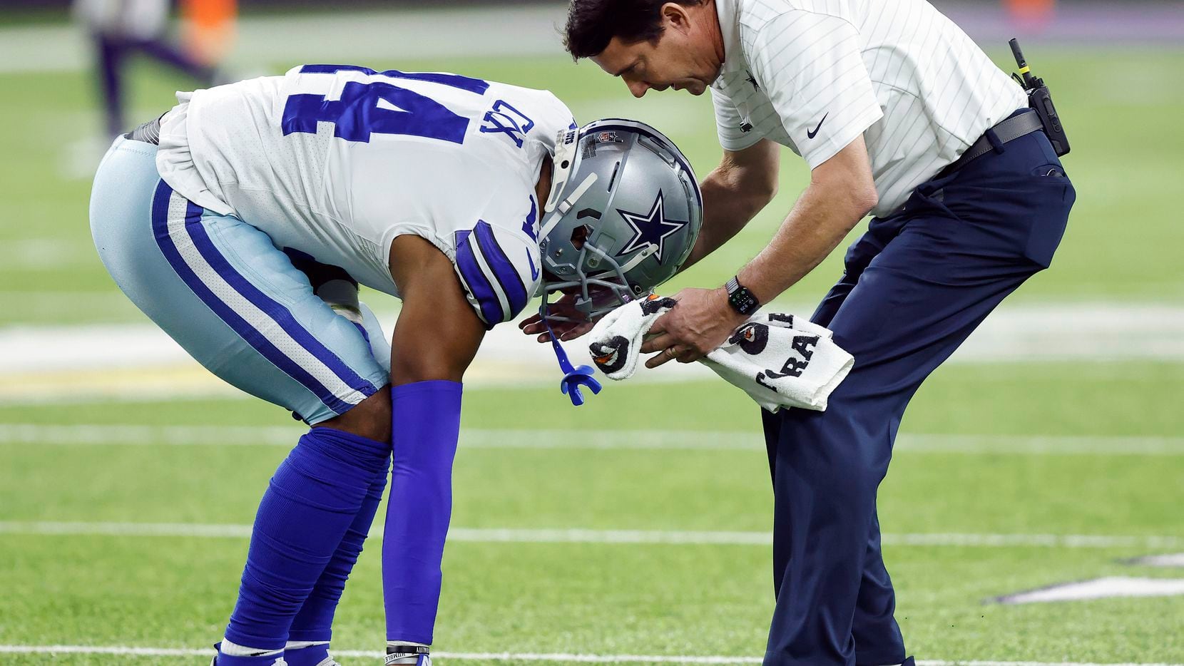 Dallas Cowboys linebacker Jabril Cox (14) tried limping off the field after sustaining a...