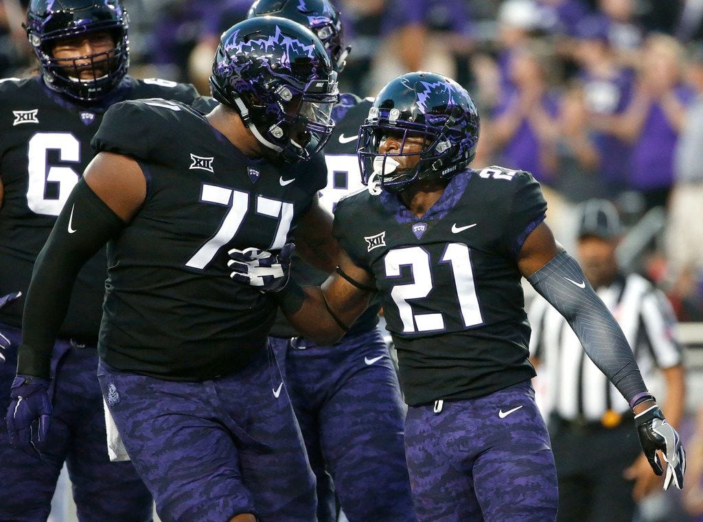 TCU's Lucas Niang (77) has been paving the way for running backs since Kyle Hicks (21) was...