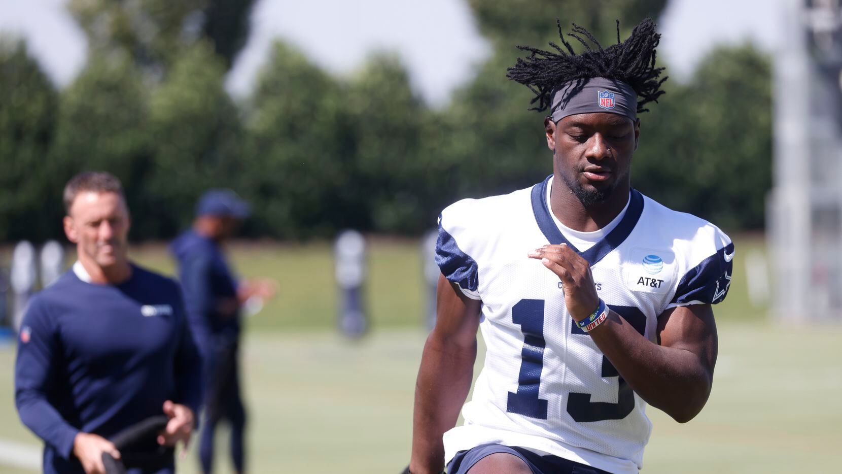 Dallas Cowboy’s wide receiver Michael Gallup (13) works with a resistance band during a...