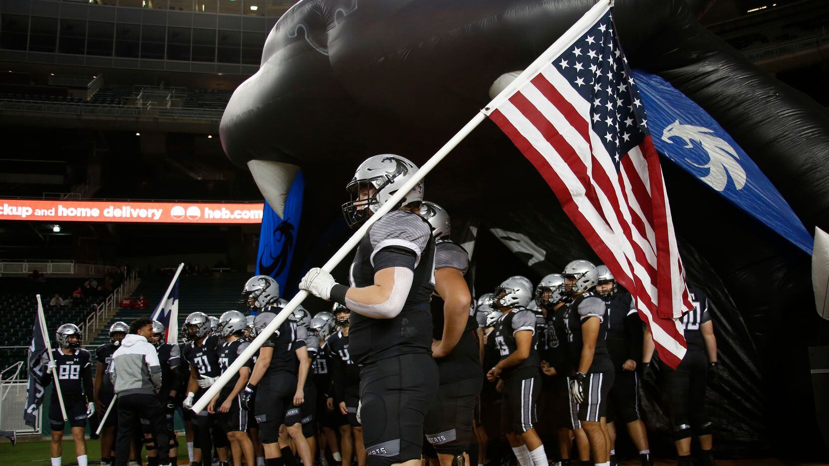 Denton Guyer players await the team introductions prior to the opening kickoff against...