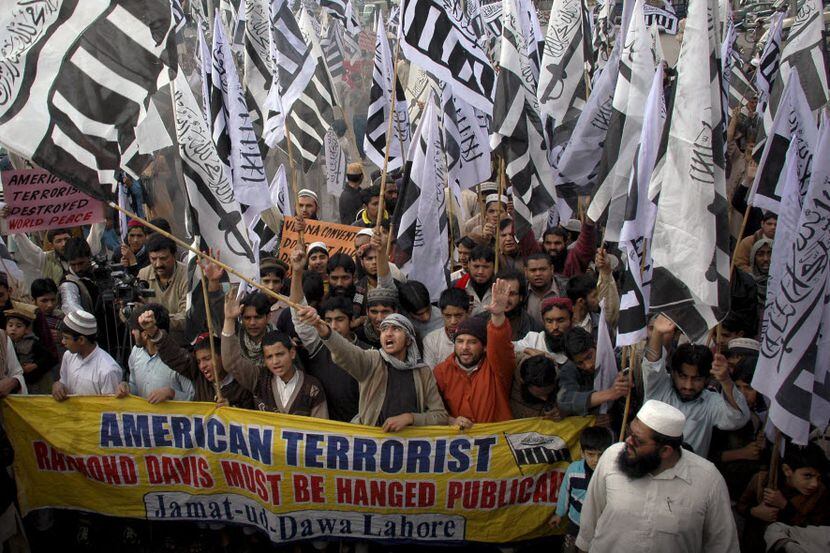 Demonstrators in Pakistan march in support of Hafiz Saeed, the leader of terrorist group...