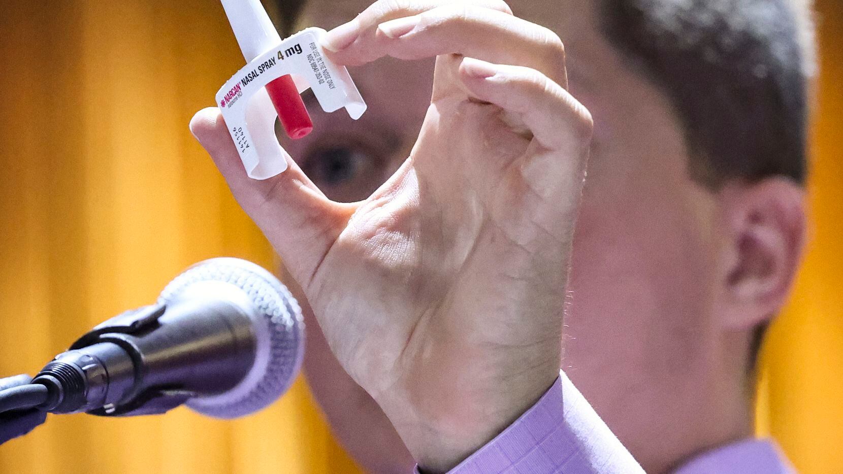 Richard Bradshaw holds Narcan nasal spray while telling the audience how to administer a...