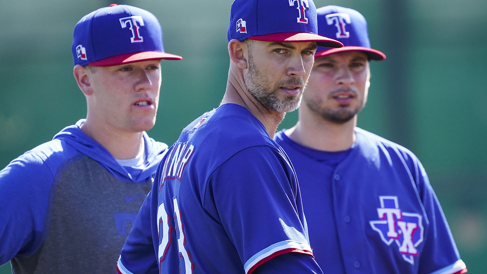 Texas Rangers pitcher Mike Minor (participates in a fielding drill during a spring training...