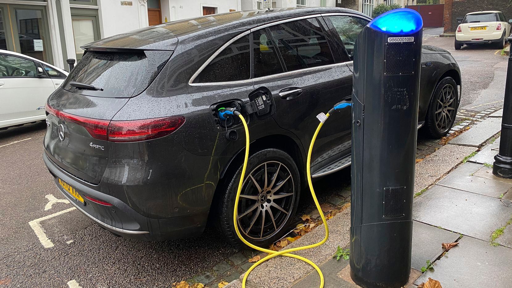 An electric vehicle charges at a public fast-charging station in London on Oct. 20, 2022....