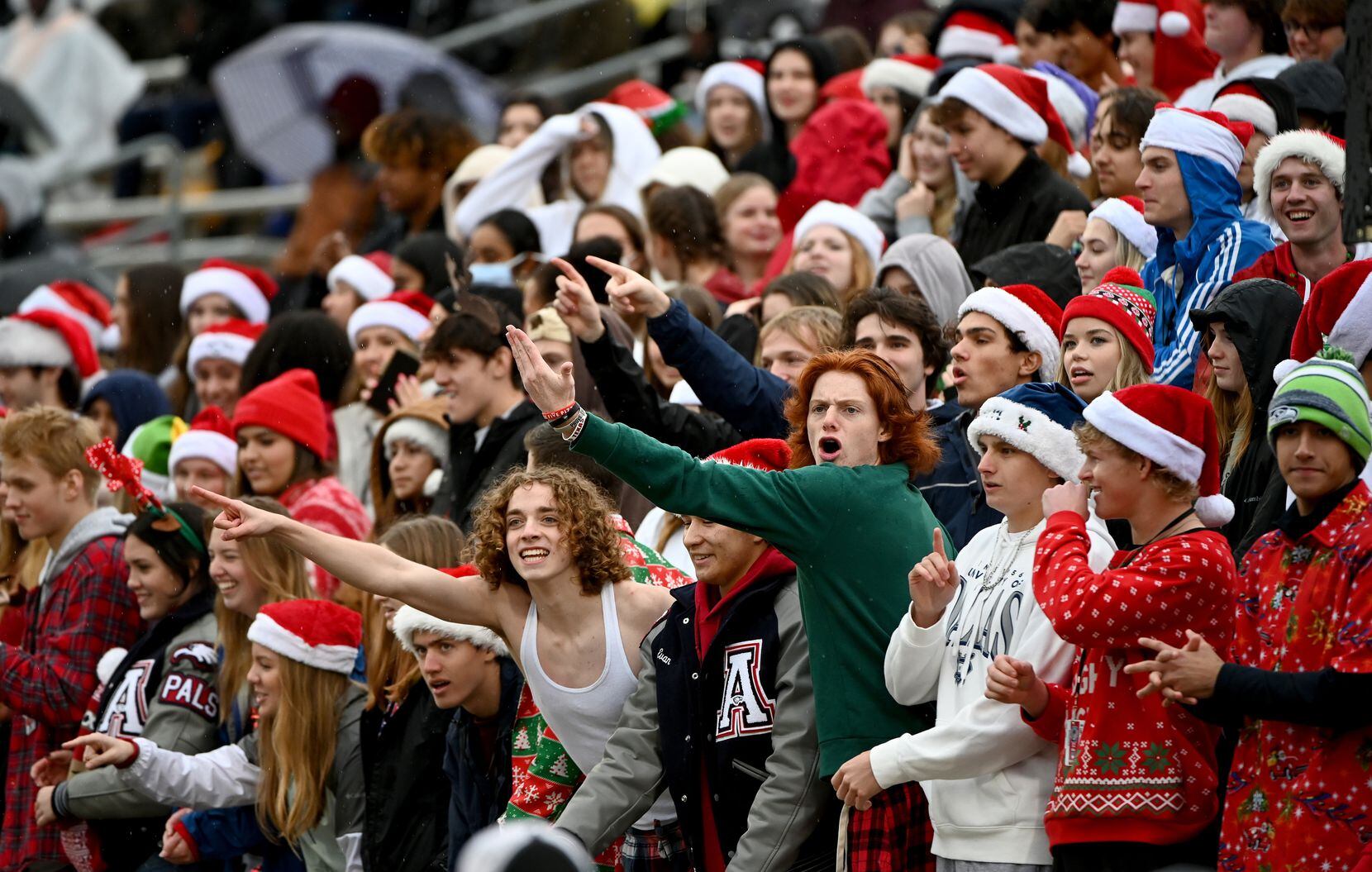 Allen students cheer in the first half of Class 6A Division I Region I semifinal playoff...