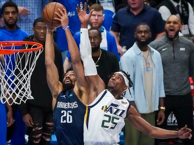 Dallas Mavericks guard Spencer Dinwiddie (26) grabs a defensive rebound away from Utah Jazz...