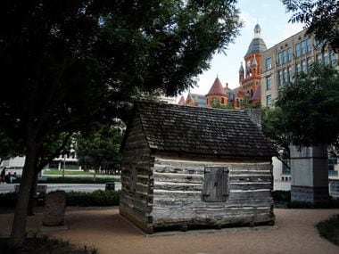 A replica of John Neely Bryan Cabin is pictured in Founders Plaza on Elm Street in downtown...