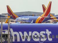 A Southwest Airlines flight taxis to the gate at Dallas Love Field on June 18.