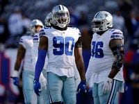 Dallas Cowboys defensive end Demarcus Lawrence (90) and defensive tackle Neville Gallimore (96) line up  for pregame stretching before facing the New York Giants at MetLife Stadium in East Rutherford, New Jersey, Sunday, December 19, 2021.