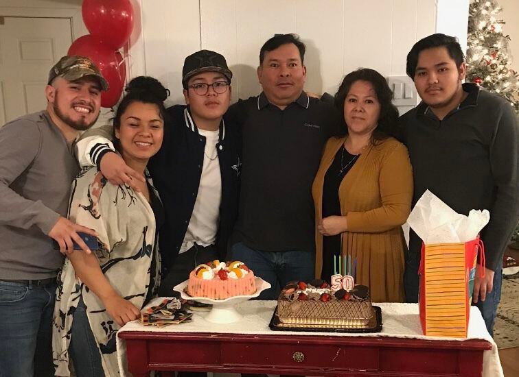 The Delgado family at Alfonso's 50th birthday party in Dec. 2020. From left, sons and...