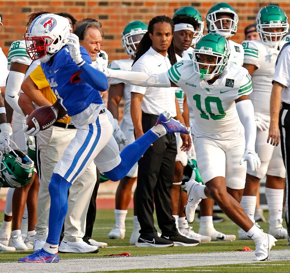 Southern Methodist Mustangs wide receiver Rashee Rice (11)  is run out of bounds after the catch by North Texas Mean Green defensive back Makyle Sanders (10) during the first half as SMU hosted UNT at Ford Stadium in Dallas on Saturday, September 11, 2021. (Stewart F. House/Special Contributor)