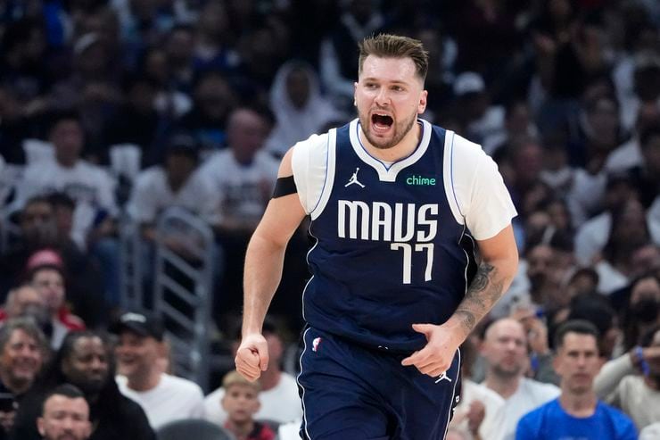 Dallas Mavericks guard Luka Doncic yells after scoring during the first half in Game 5 of an...