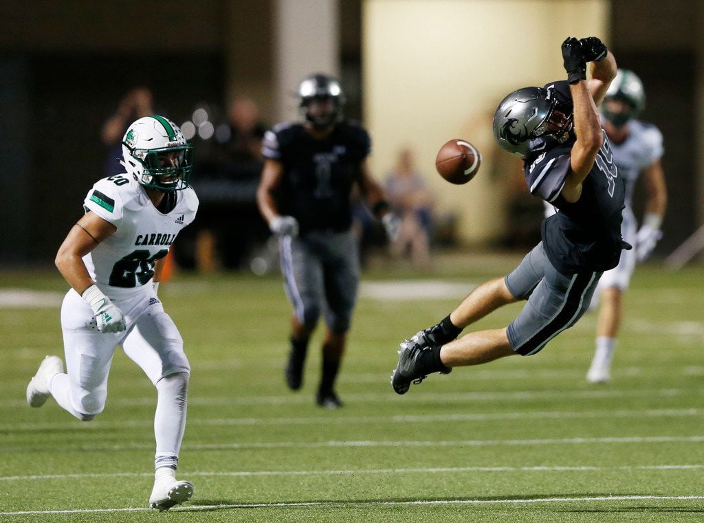 Denton Guyer's Seth Meador (19) can't make the catch as Southlake Carroll's James Miscoll (20) closes in on the play during the first half of play at C.H. Collins Complex in Denton, on Friday, October 4, 2019. (Vernon Bryant/The Dallas Morning News)
