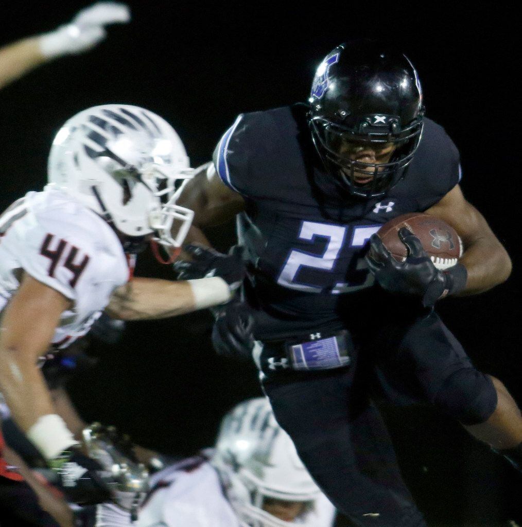 Trinity Christian Cedar Hill running back Dez Moultrie (23) Bolts up the middle past the...