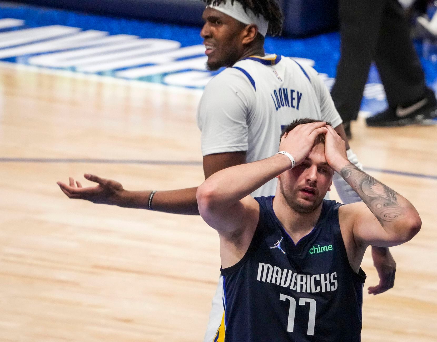 Dallas Mavericks guard Luka Doncic (77) reacts after being fouled by Golden State Warriors...