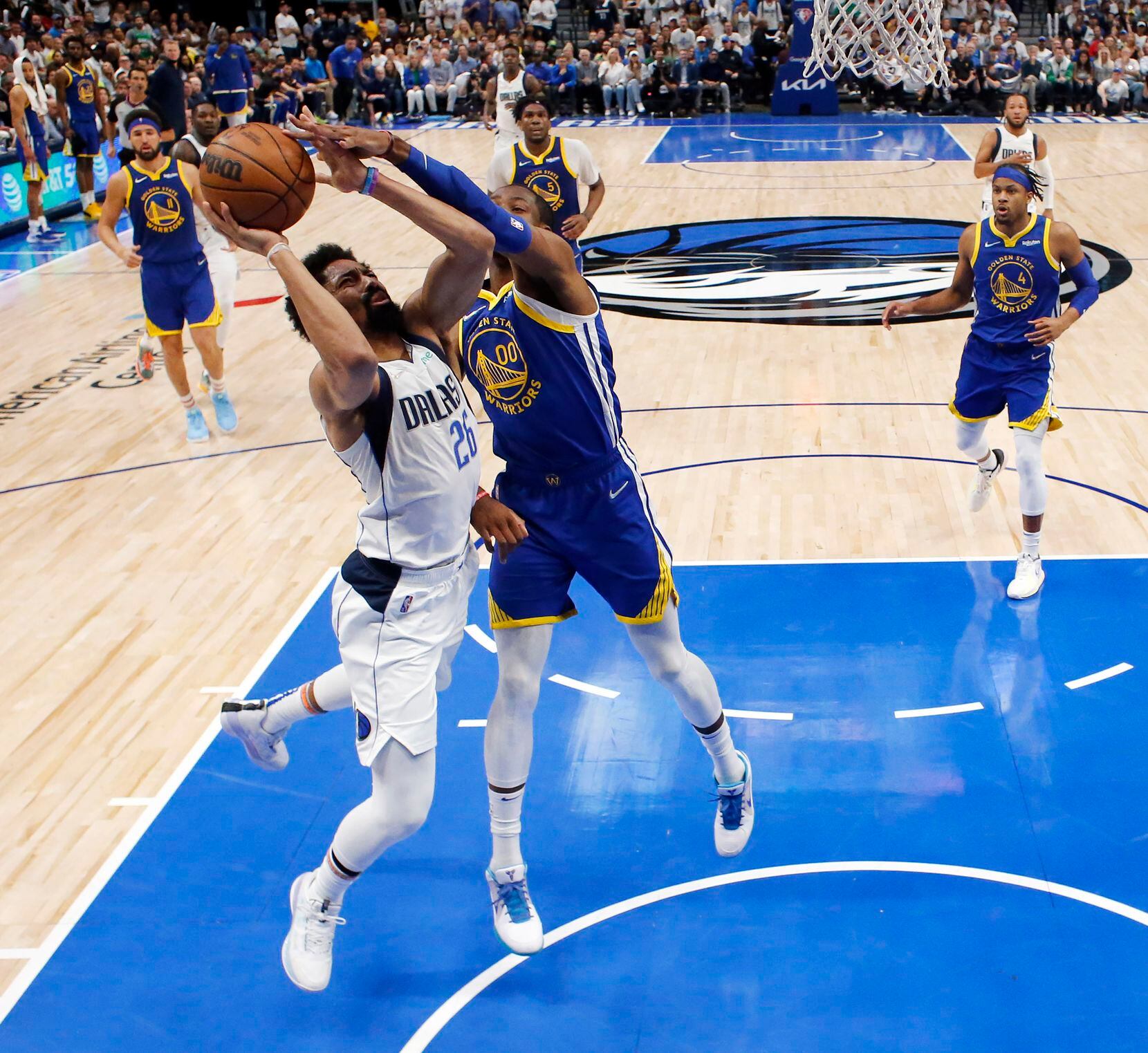 Dallas Mavericks guard Spencer Dinwiddie (26) is fouled by Golden State Warriors forward...