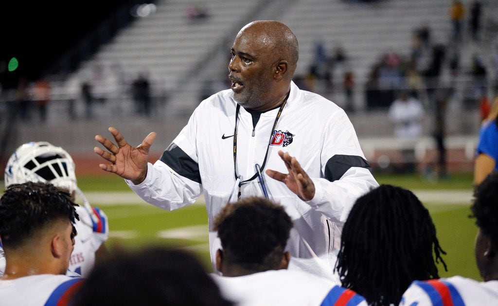 Duncanville head coach Reginald Samples gathers his players together for a postgame huddle after defeating Lancaster, 24-3, at Beverly D. Humphrey Tiger Stadium in Lancaster Texas, Friday, August 30, 2019. (Tom Fox/The Dallas Morning News)