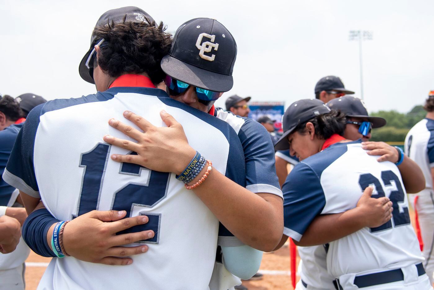 Central Catholic players embrace after losing the TAPPS Division I baseball state...