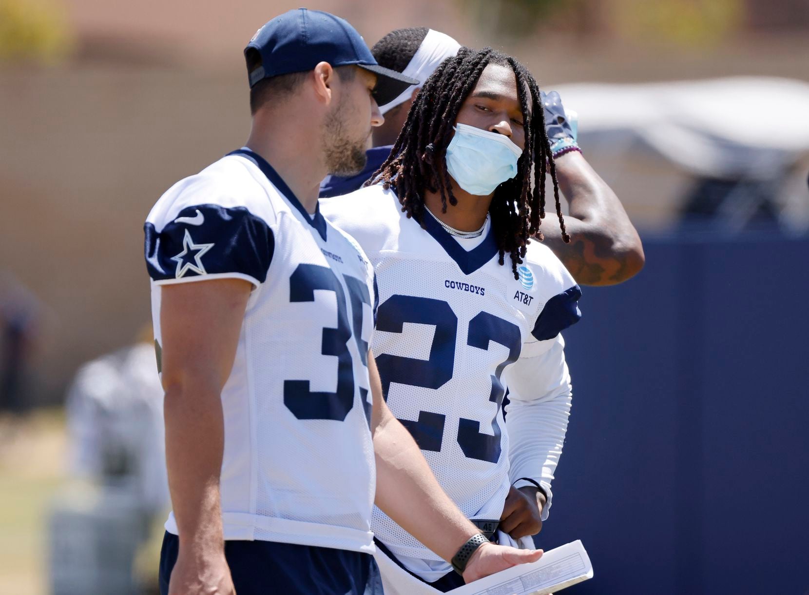 Dallas Cowboys running back Rico Dowdle (23) wears a mask as he comes out of COVID protocol...