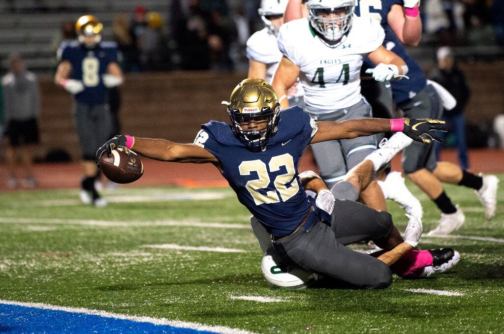 Jesuit senior running back EJ Smith (22) stretches for the goal line on a touchdown run in...