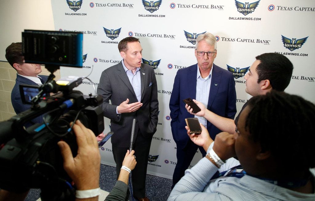 Dallas Wings President and CEO Greg Bibb, left, and head coach Brian Agler talks to the...