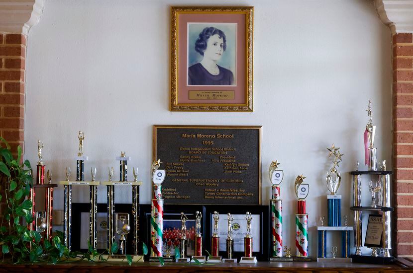 Memorabilia and trophies remain at the front entrance of Maria Moreno Elementary School in...