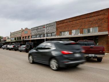Cars drive along Pecan Street near the town square in Celina on Aug. 23.