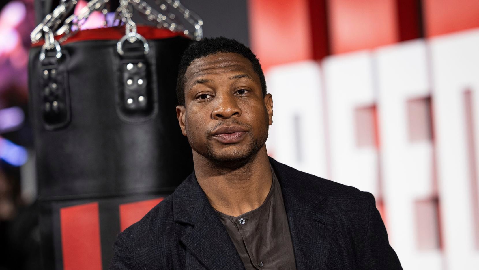 Jonathan Majors poses for photographers upon arrival for the premiere of the film Creed III...