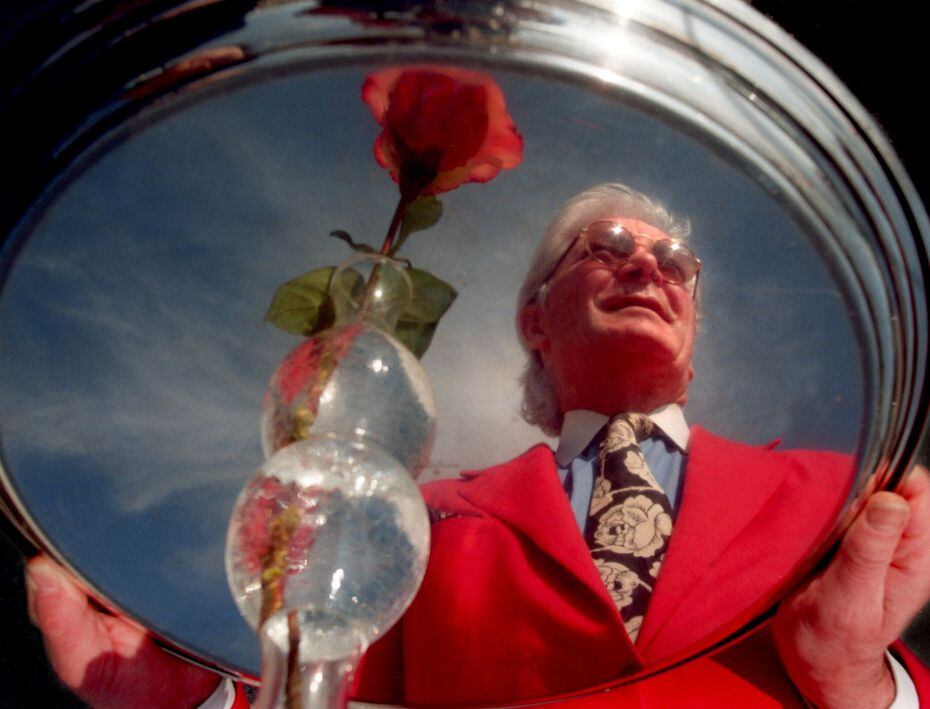 Franco Bertolasi, owner of the Riviera, is reflected in a silver tray outside his restaurant...