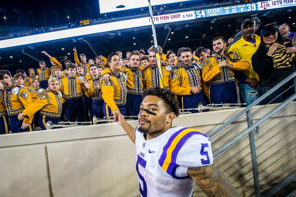 LSU running back Derrius Guice gets a hand from members of the LSU band after an NCAA football game against Texas A&M at Kyle Field on Thursday, Nov. 24, 2016, in College Station, Texas.  LSU won the game 54-39. (Smiley N. Pool/The Dallas Morning News)