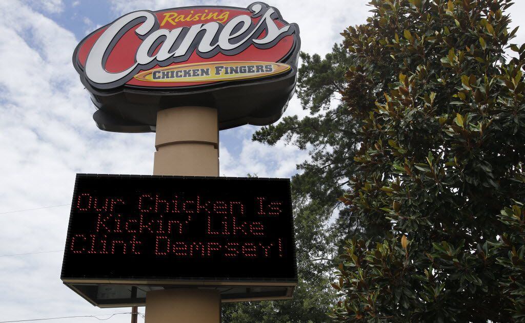 A Raising Cane's Chicken Fingers sign shows support for the town's hometown hero, Clint...