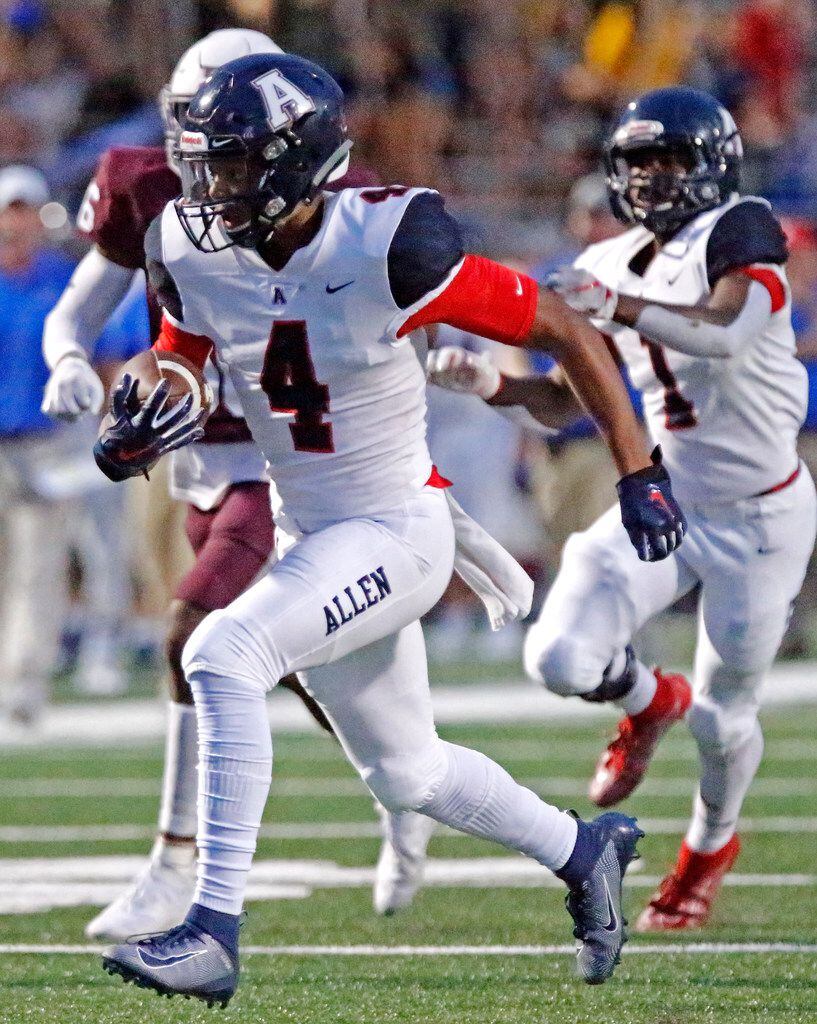 Allen High School wide receiver Darrion Sherfield (4) gets a big gain during the first half...